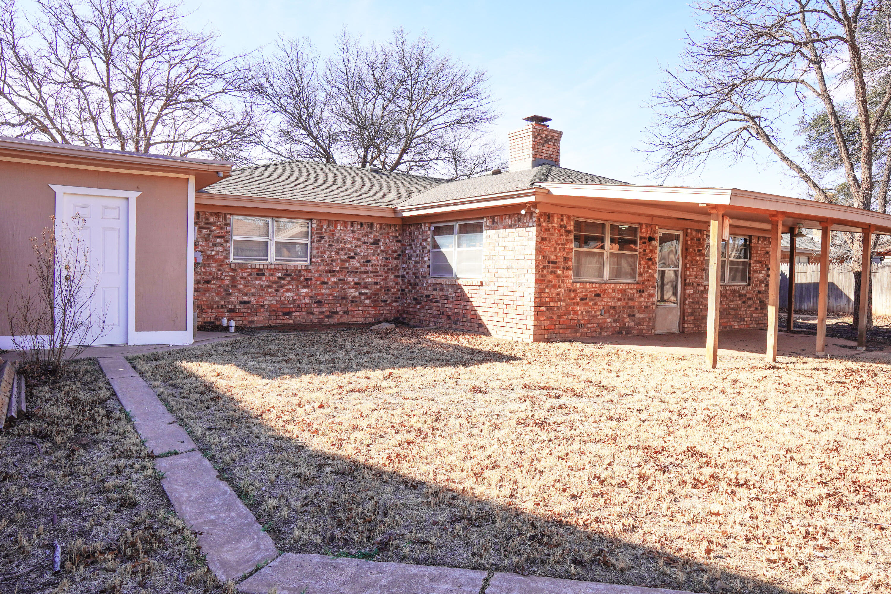 5520 80th Street Lubbock, TX 79424 - Photo 29 of 29 a front view of a house with a yard covered in snow