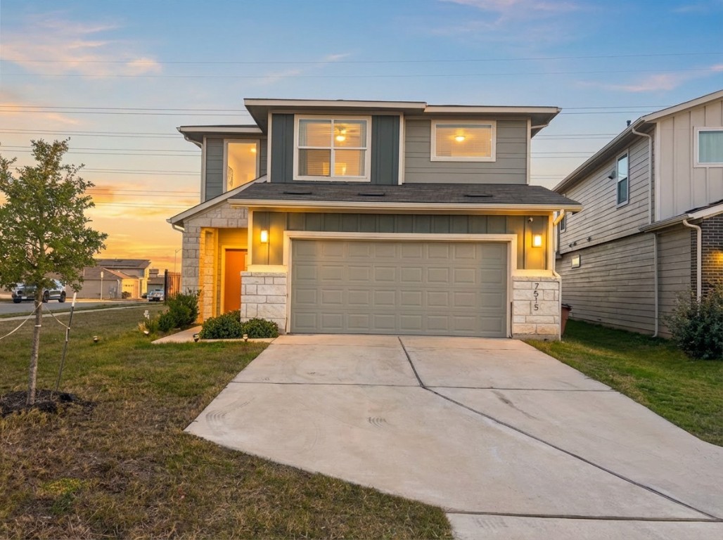 7515 Traylor Cove Austin, TX 78724 - Photo 1 of 13 a front view of a house with garden