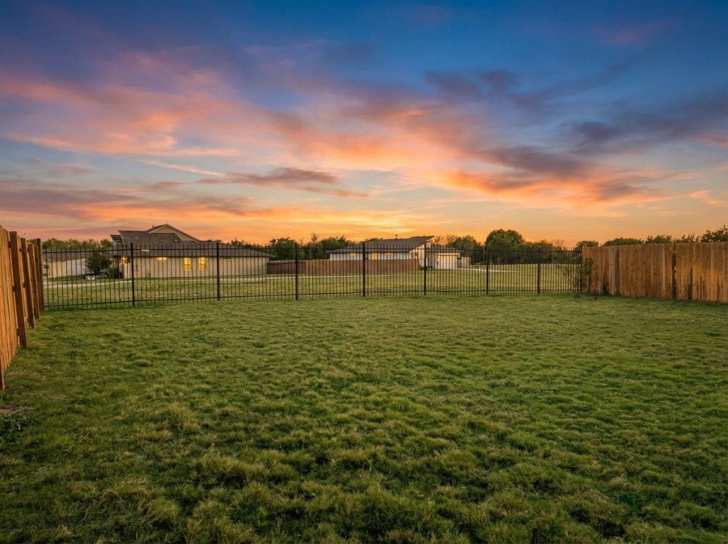 7515 Traylor Cove Austin, TX 78724 - Photo 2 of 13 a view of a garden with a building in the background