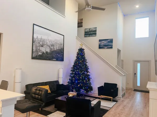 a living room with furniture and a flat screen tv