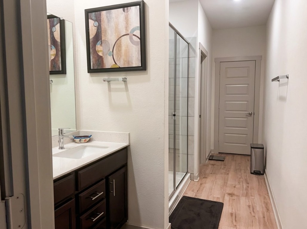 7515 Traylor Cove Austin, TX 78724 - Photo 7 of 13 a bathroom with a sink and mirror