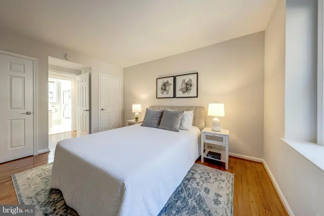 a bed room with a bed and a chair