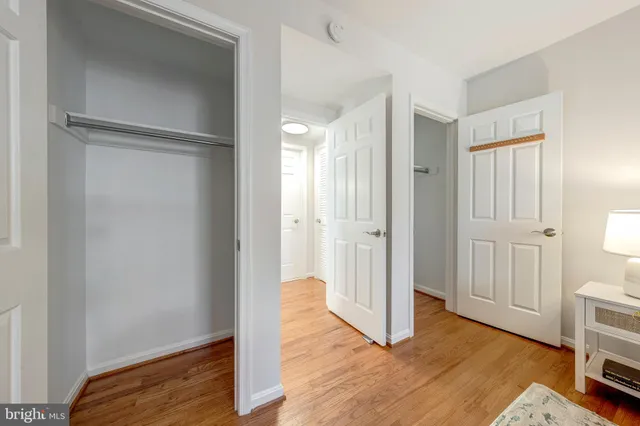 a view of a livingroom with wooden floor and closet