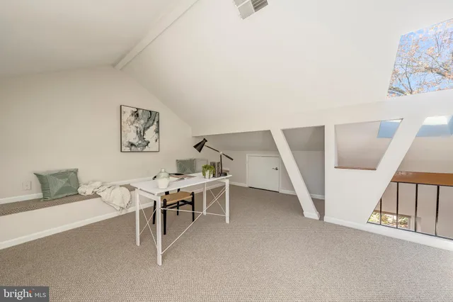 a view of a livingroom with furniture and white walls