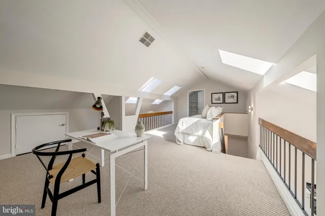 a bedroom with furniture and a wooden floor