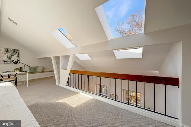 a view of a hallway with stairs