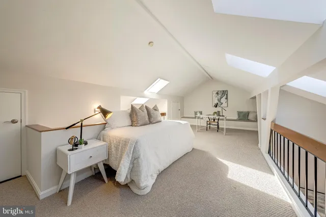 a bed room with furniture and white walls
