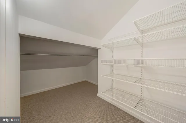 a view of an empty walk in closet