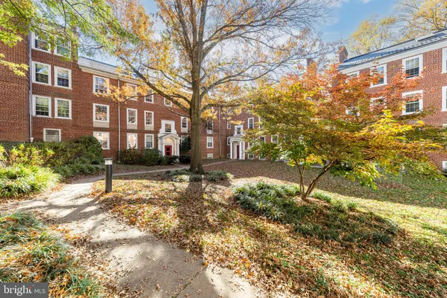 a view of a building with a yard