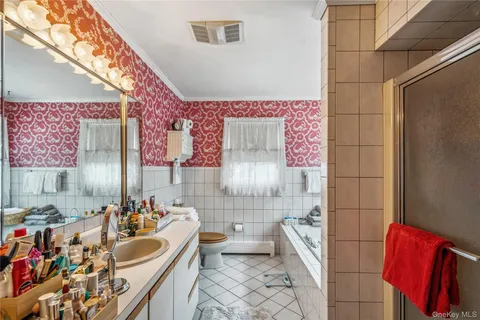 a bathroom with a sink a vanity and a mirror