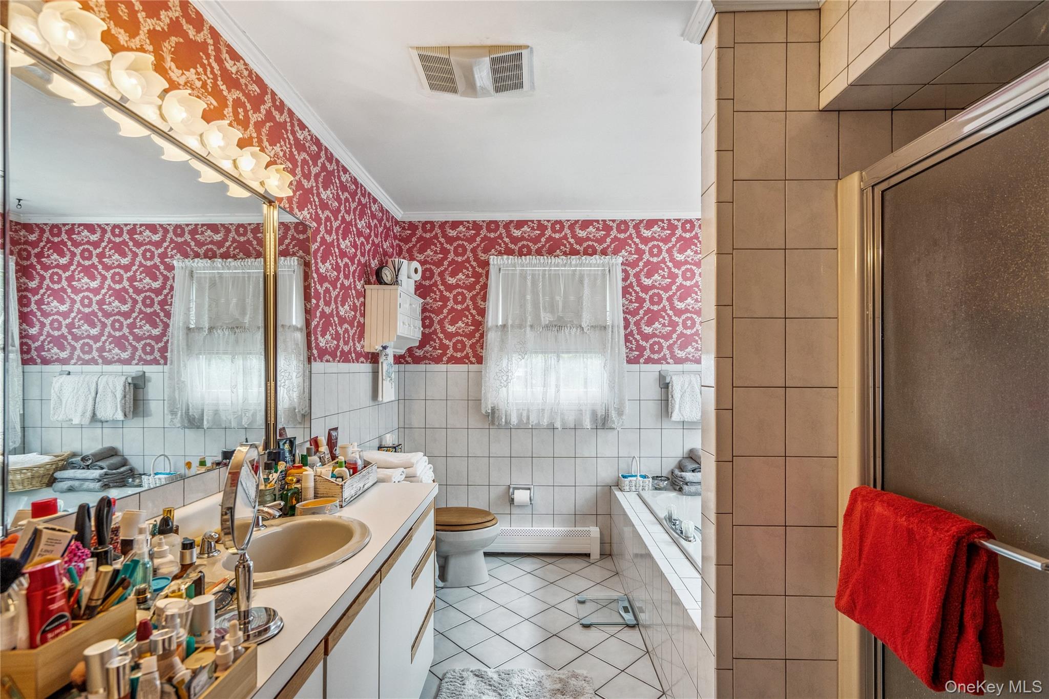 6 Cedar Avenue Locust Valley, NY 11560 - Photo 13 of 31 a bathroom with a sink a toilet and shower