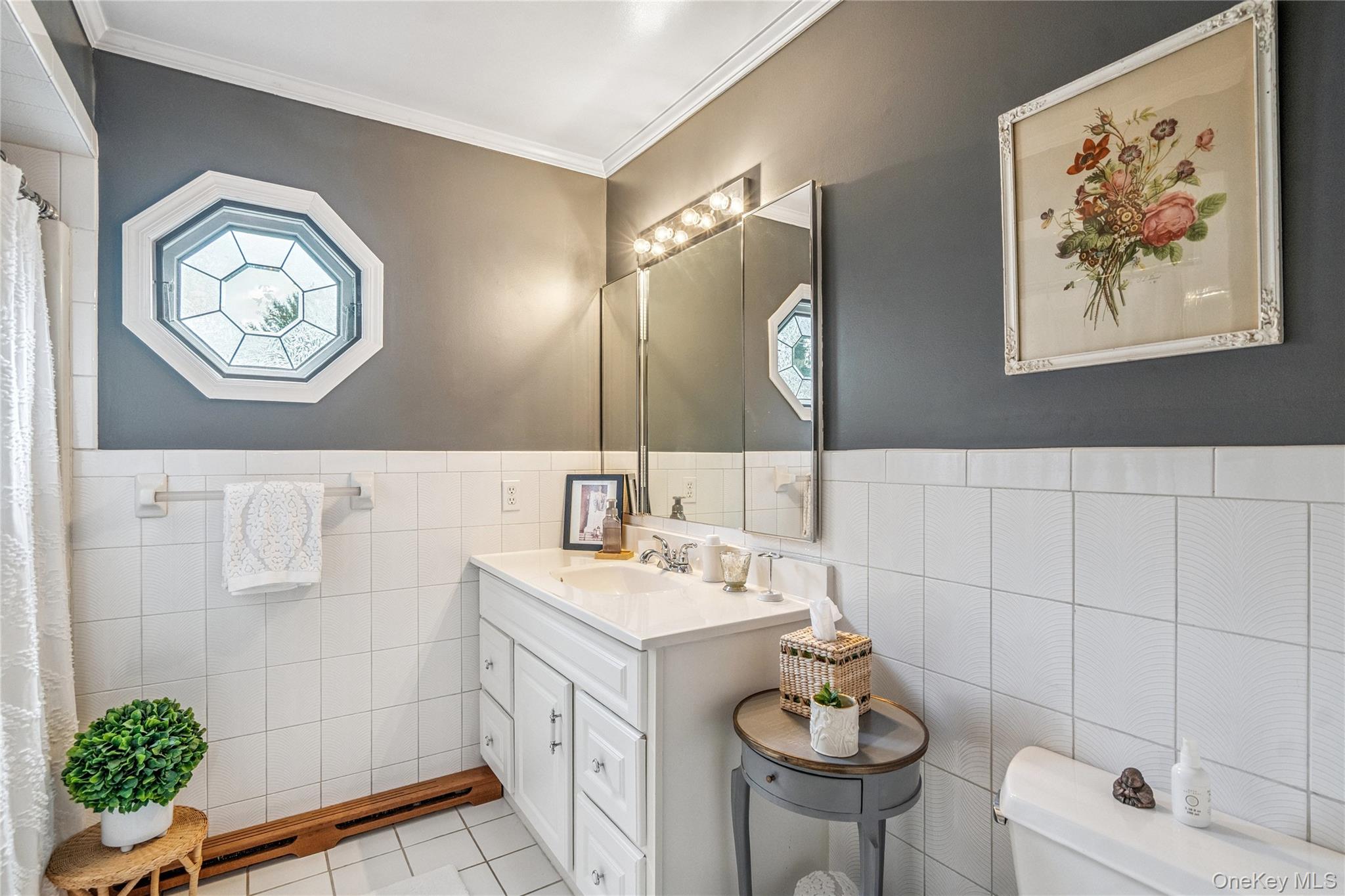 6 Cedar Avenue Locust Valley, NY 11560 - Photo 14 of 31 a bathroom with a sink a vanity and a mirror