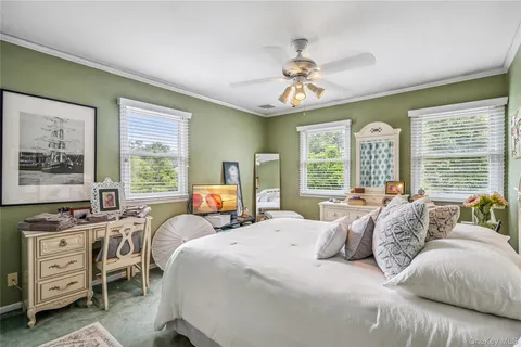 a bedroom with a bed and a table