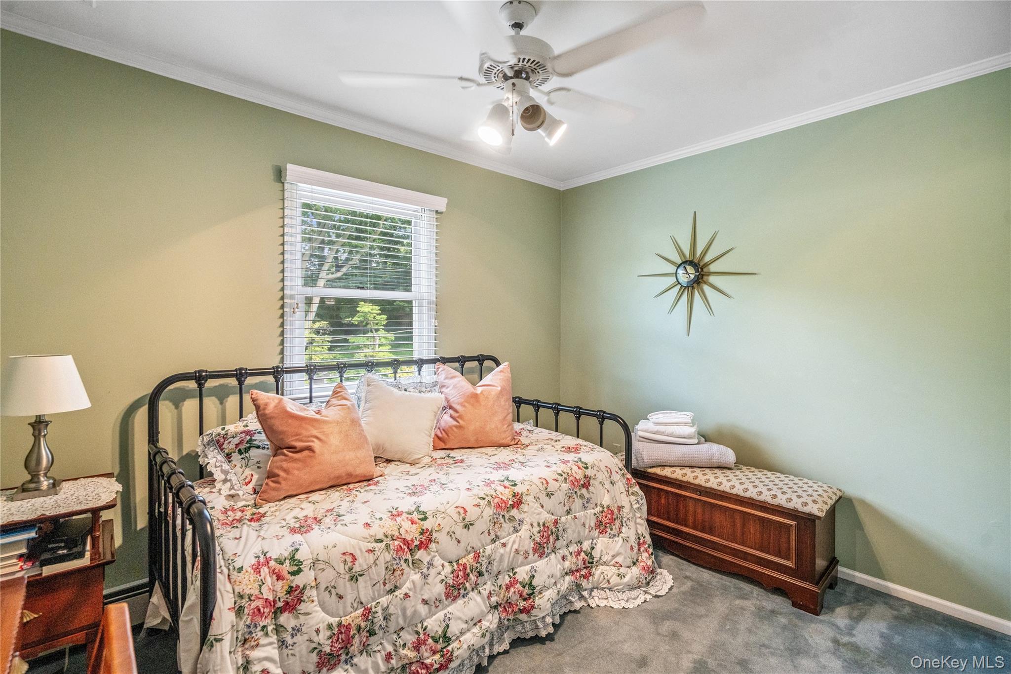 6 Cedar Avenue Locust Valley, NY 11560 - Photo 19 of 31 a bedroom with a bed a chandelier and a window