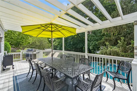 a view of a balcony with wooden floor