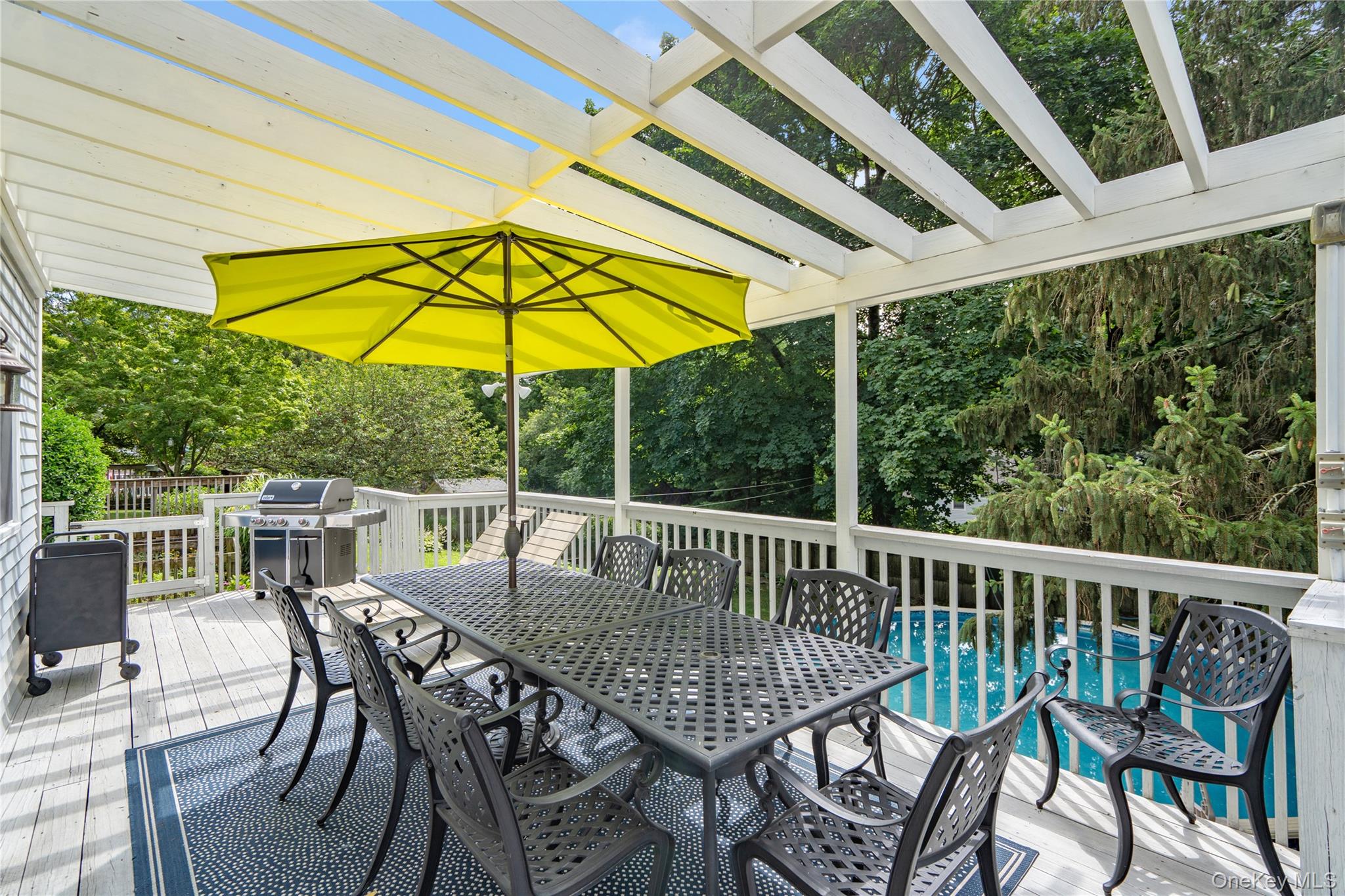 6 Cedar Avenue Locust Valley, NY 11560 - Photo 23 of 31 a view of balcony with furniture and umbrella