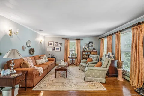a living room with furniture and large window