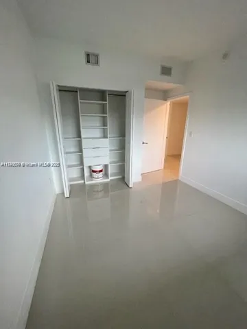 a view of a storage & utility room with a sink