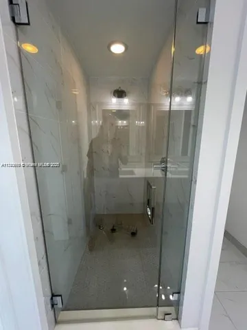 a view of swimming pool with outdoor seating and plants