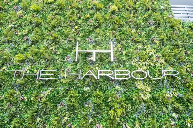 a living room with fireplace furniture and a large window