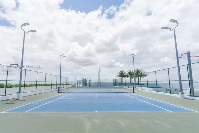 a view of a swimming pool with a lawn chairs