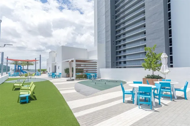 a view of balcony with two chairs and a potted plant