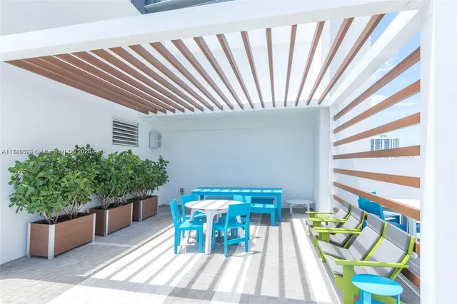 a view of a patio with swimming pool