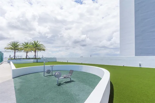 a view of ocean with a multi story building