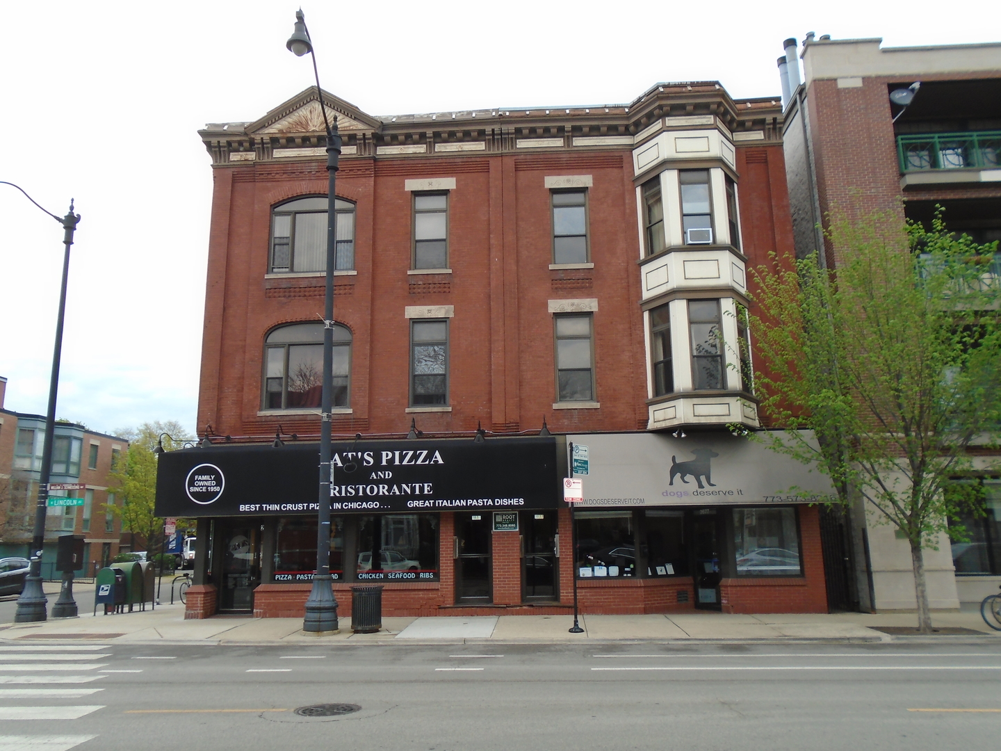 a front view of a building and a street