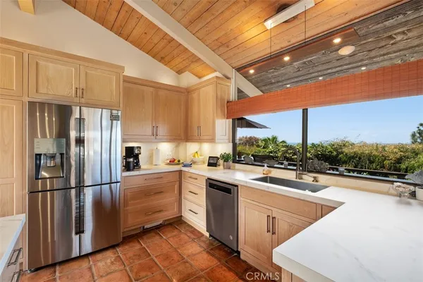 a open kitchen with stainless steel appliances granite countertop a sink and cabinets