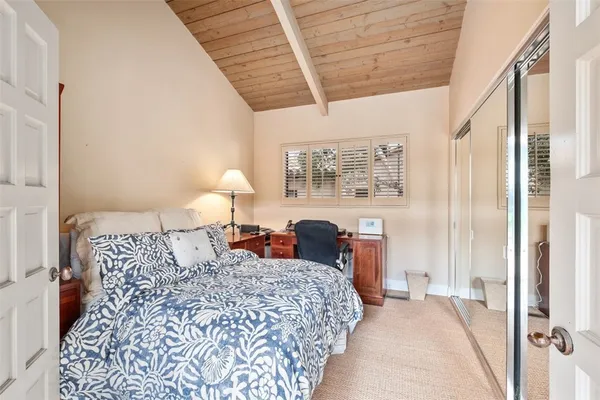 a large bathroom with a double vanity sink a mirror and a shower