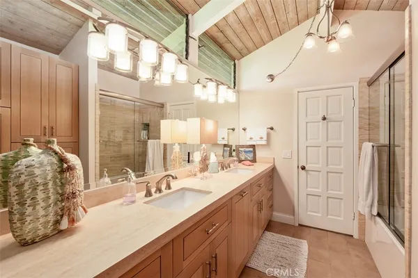 a bedroom with two beds and a large window