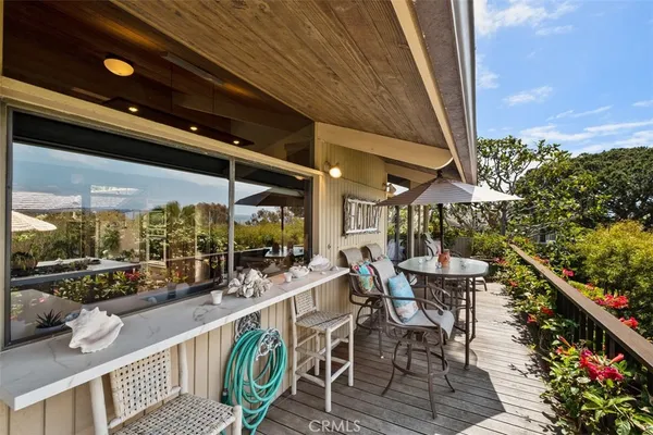 a view of a balcony with chairs
