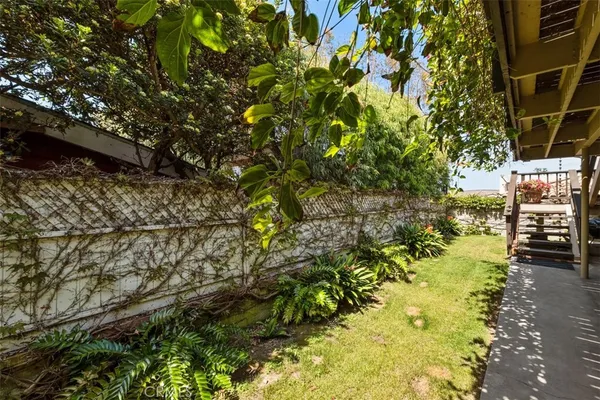 a view of backyard with a patio