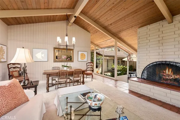 a kitchen with a sink a counter and chairs