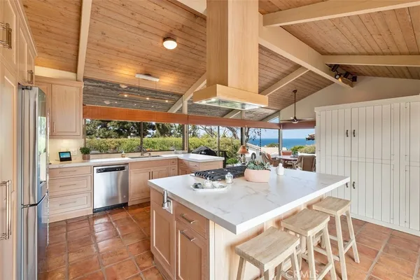 a kitchen with a stove a refrigerator and a stove