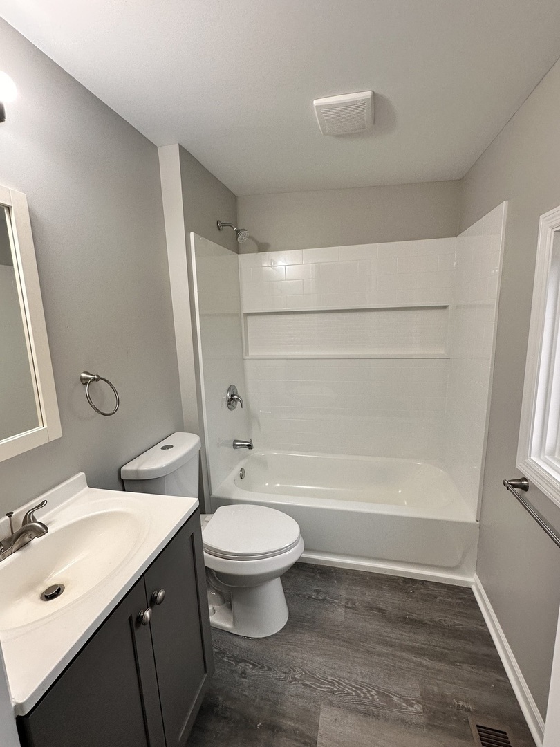 920 Hall Street Streator, IL 61364 - Photo 11 of 19 a bathroom with a sink toilet and shower