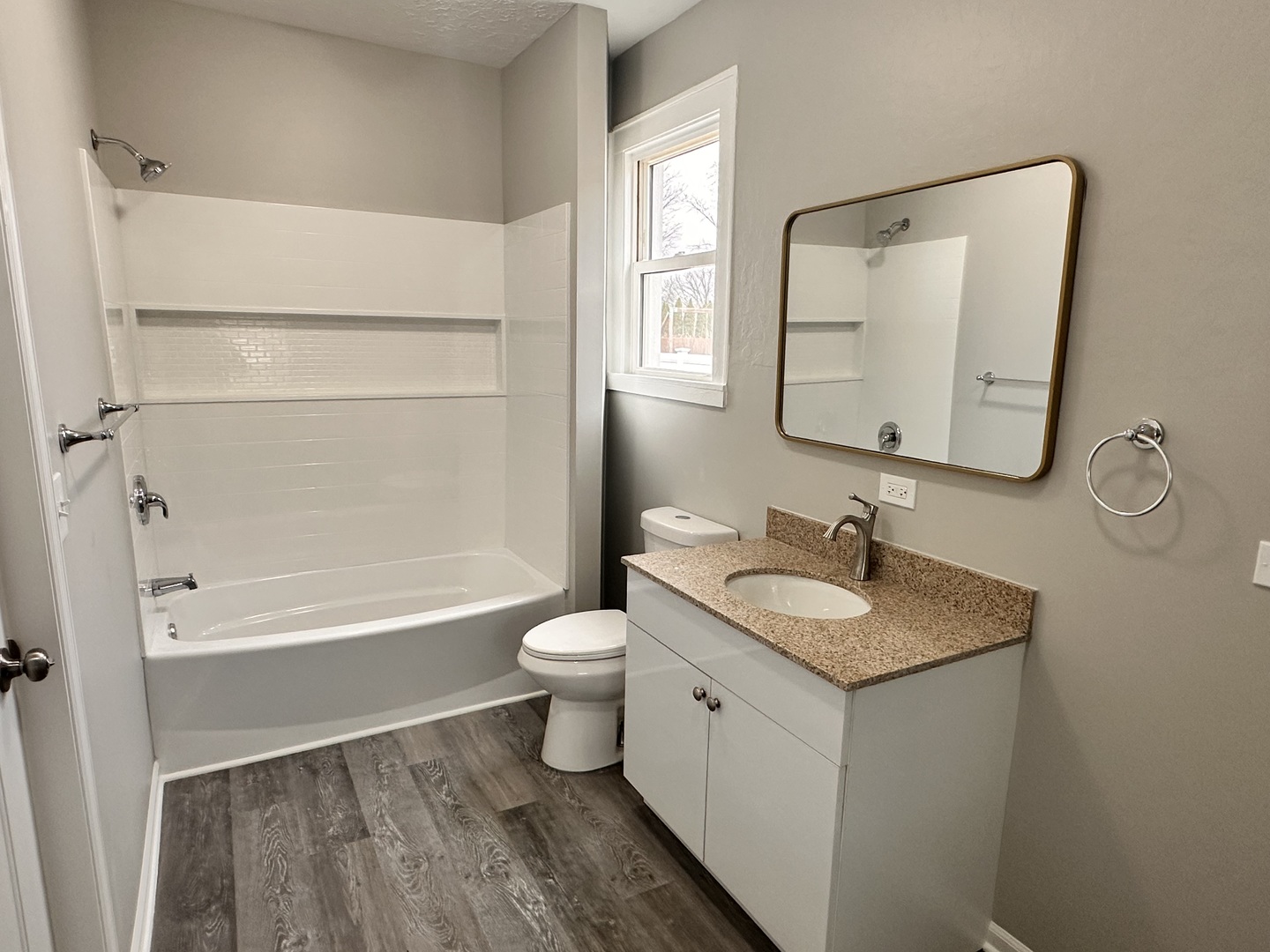 920 Hall Street Streator, IL 61364 - Photo 12 of 19 a bathroom with a granite countertop sink toilet and mirror