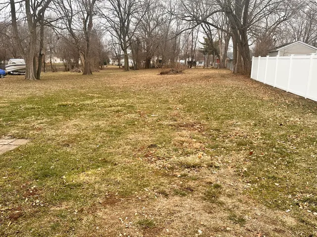 a view of yard covered with snow