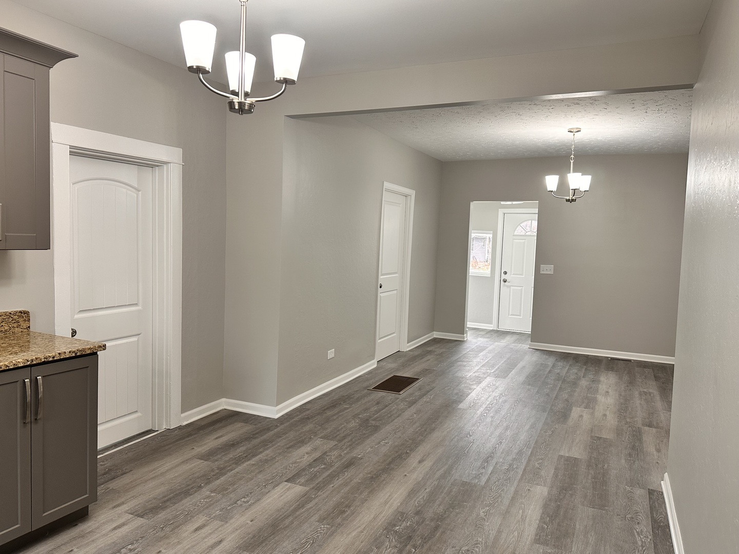 920 Hall Street Streator, IL 61364 - Photo 7 of 19 wooden floor in an empty room with a mirror