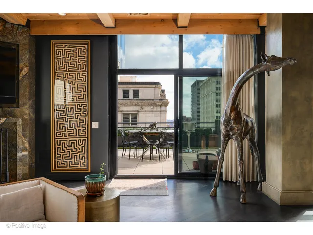a balcony with table and chairs