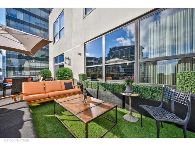 a patio with table and chairs