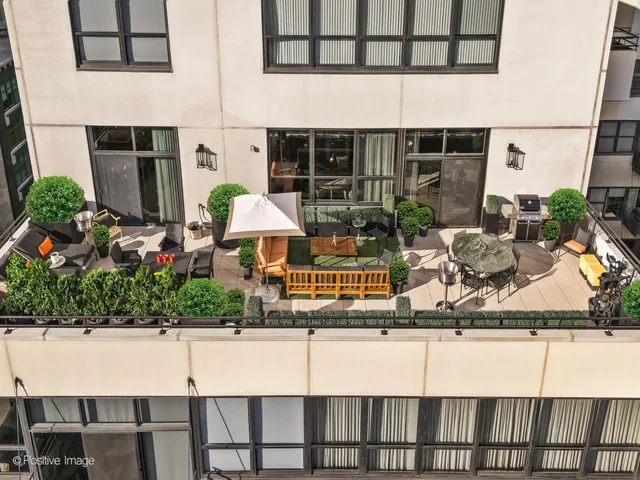 a table and chairs in front of a building