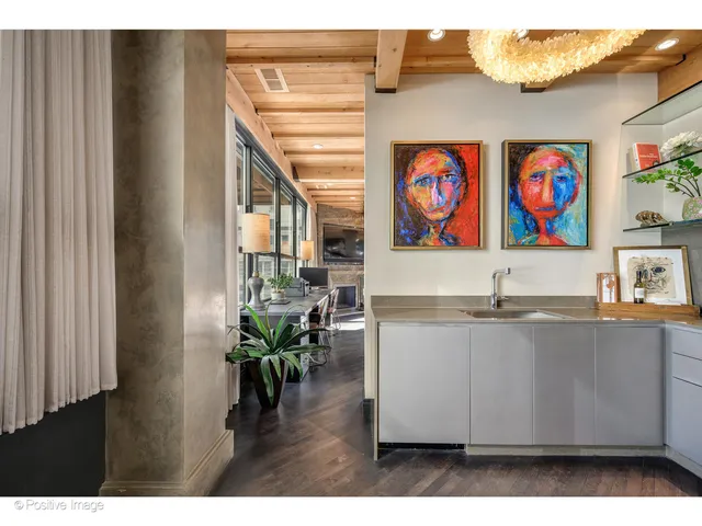 a kitchen with stainless steel appliances a sink stove and refrigerator