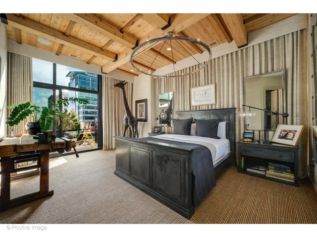 a living room filled with furniture and a potted plant