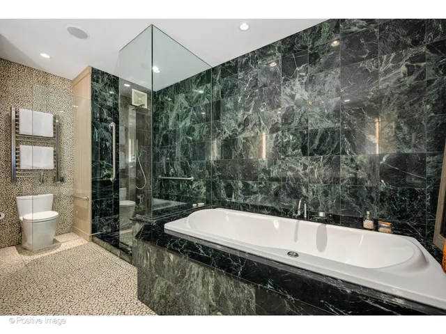 a kitchen with a refrigerator and a sink