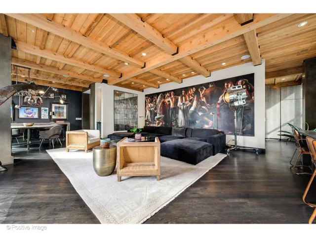 a view of a patio with table and chairs
