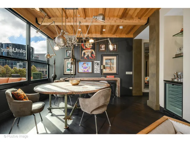 a dining room with furniture and window