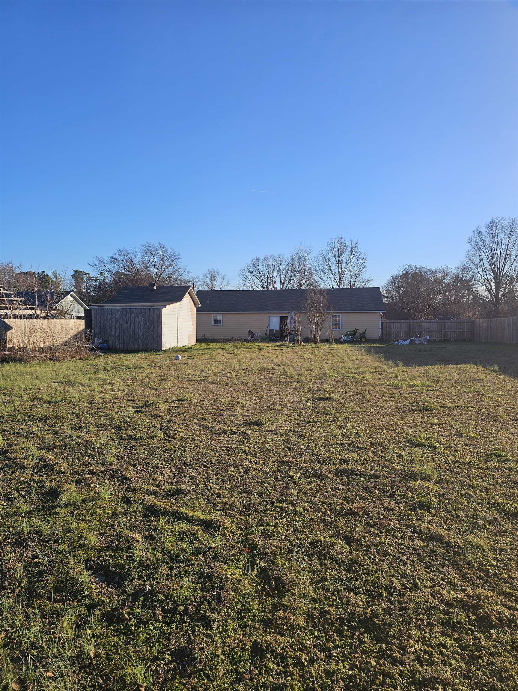 605 Jr Drive Covington, TN 38019 - Photo 21 of 21 Rear view of house featuring an outdoor structure