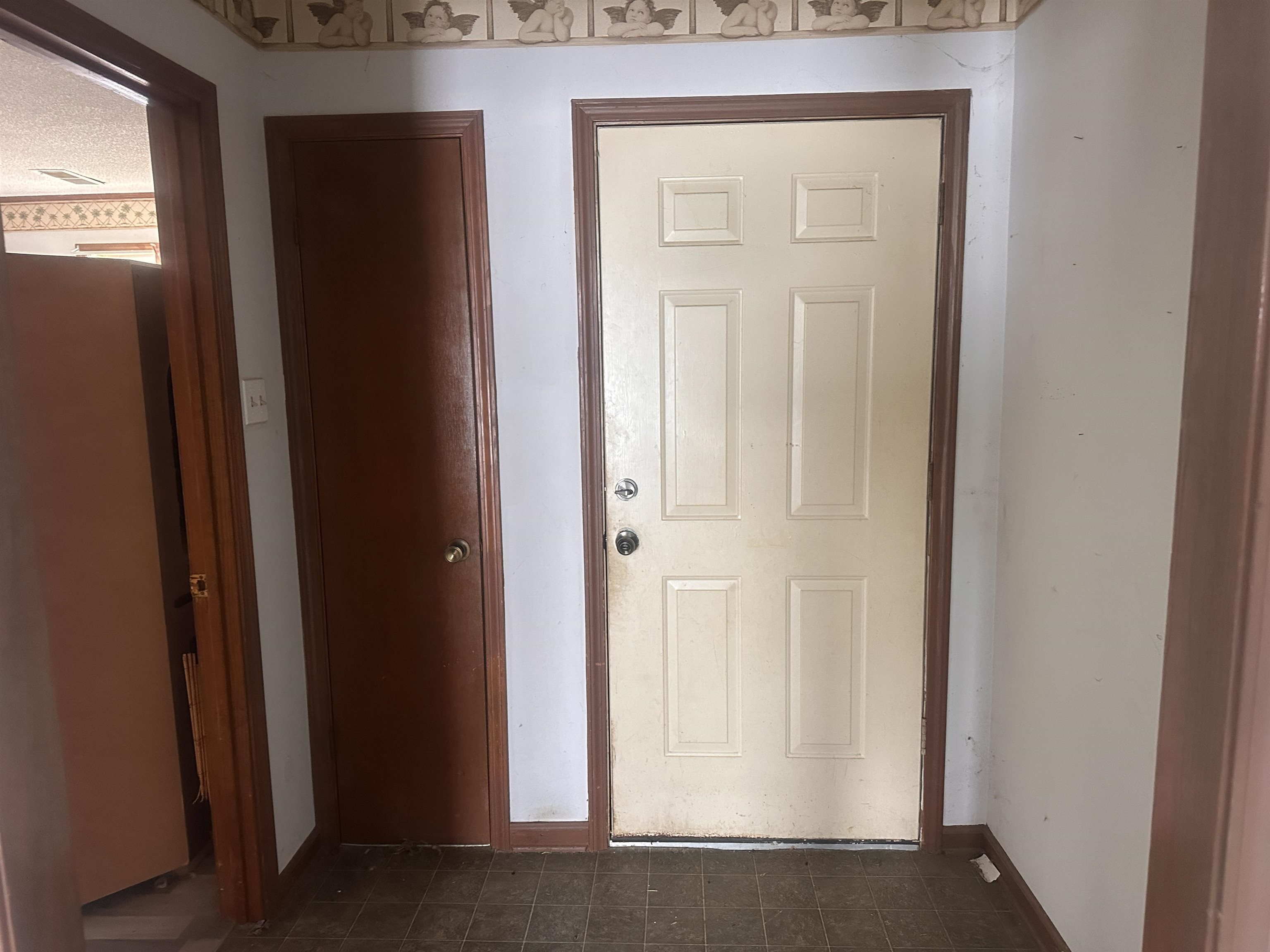605 Jr Drive Covington, TN 38019 - Photo 4 of 21 Entryway with baseboards and tile patterned floors